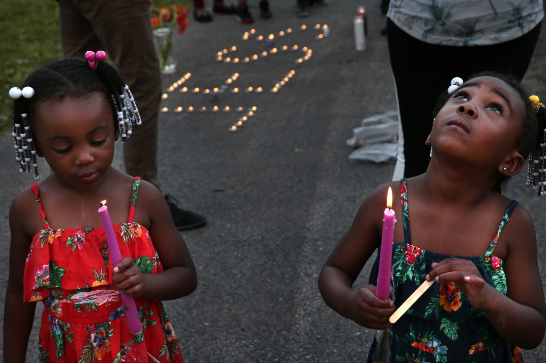 Vigil held for victims of triple fatal shooting, wounding of 7-year-old